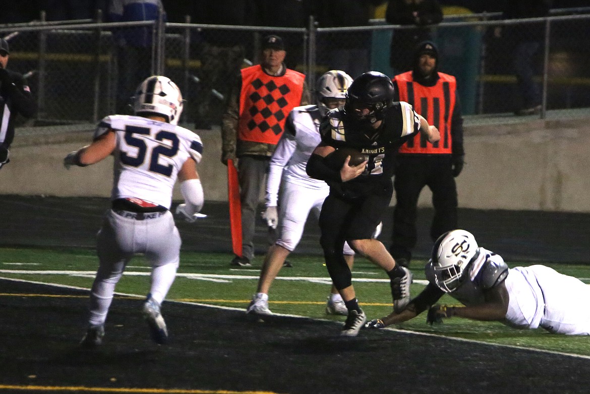 Royal junior Lance Allred carries the ball into the end zone on one of his three touchdown runs against Seton Catholic in the 1A state football semifinals.