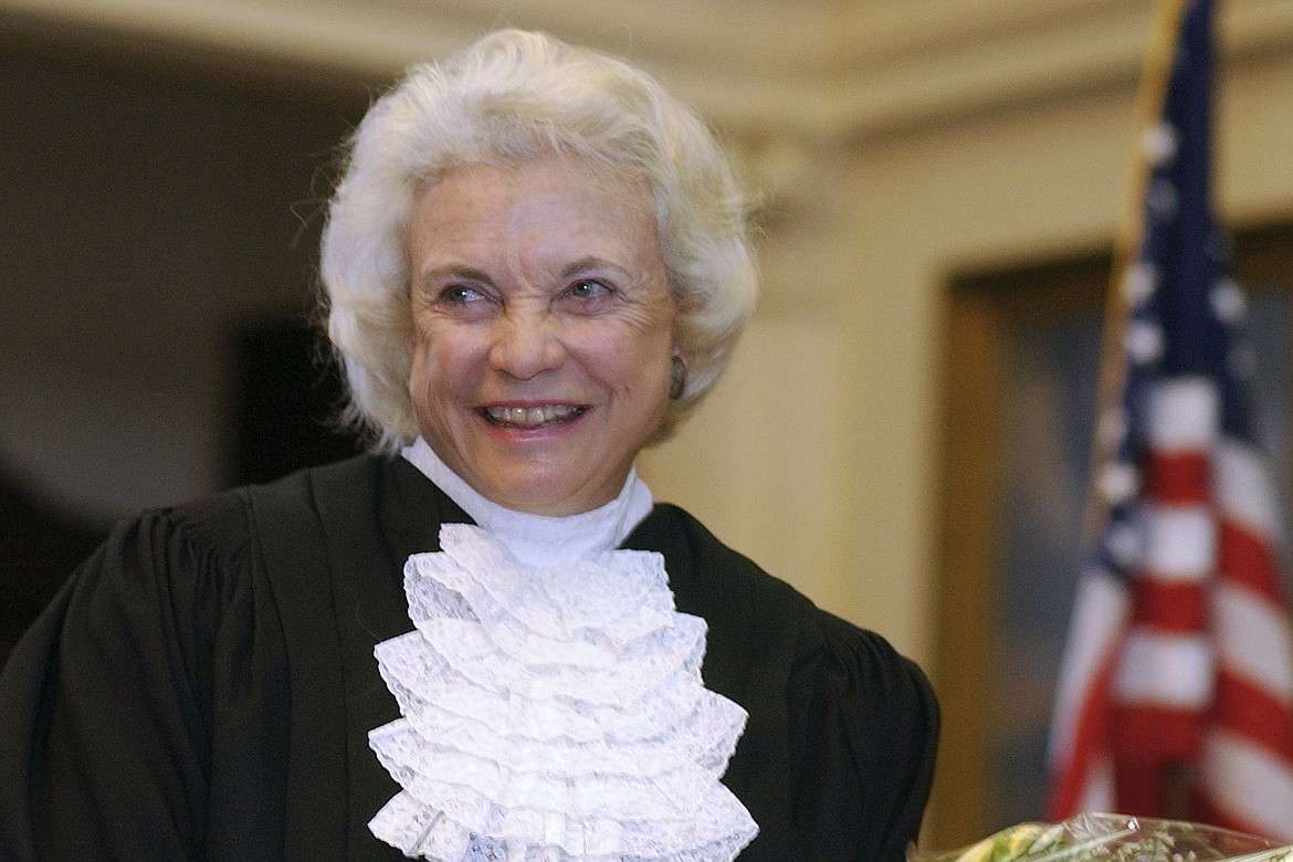 U.S. Supreme Court Justice Sandra Day O'Connor is shown before administering the oath of office to members of the Texas Supreme Court, Jan. 6, 2003, in Austin, Texas. O'Connor, who joined the Supreme Court in 1981 as the nation's first female justice, has died at age 93.(AP Photo/Harry Cabluck, File)