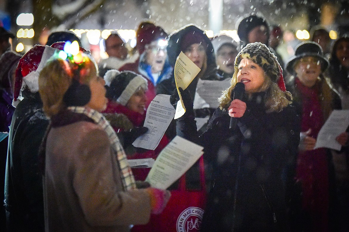 Lucy Smith and friends and the Valley Voices sing Christmas carols during the Downtown Kalispell Holiday Stroll and Tree Lighting on Friday, Dec. 1. (Casey Kreider/Daily Inter Lake)