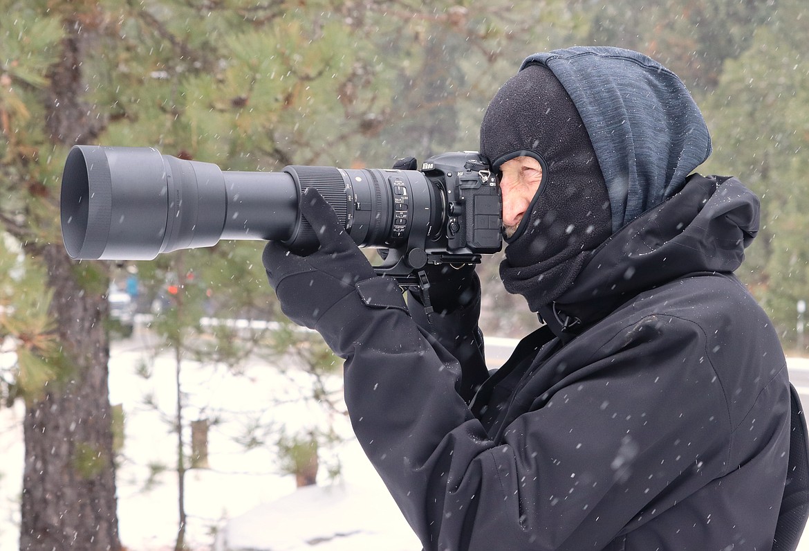 Ron Reeve focuses as he takes pictures of a bald eagle near Higgens Point on Friday morning.