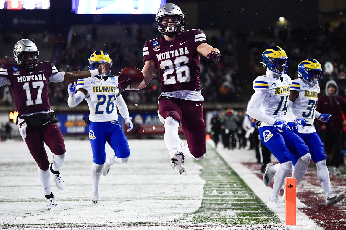 Grizzlies running back Nick Ostmo (26) leaps into the end zone on a 35-yard touchdown run in the second quarter against Delaware on Saturday, Dec. 2. (Casey Kreider/Daily Inter Lake)