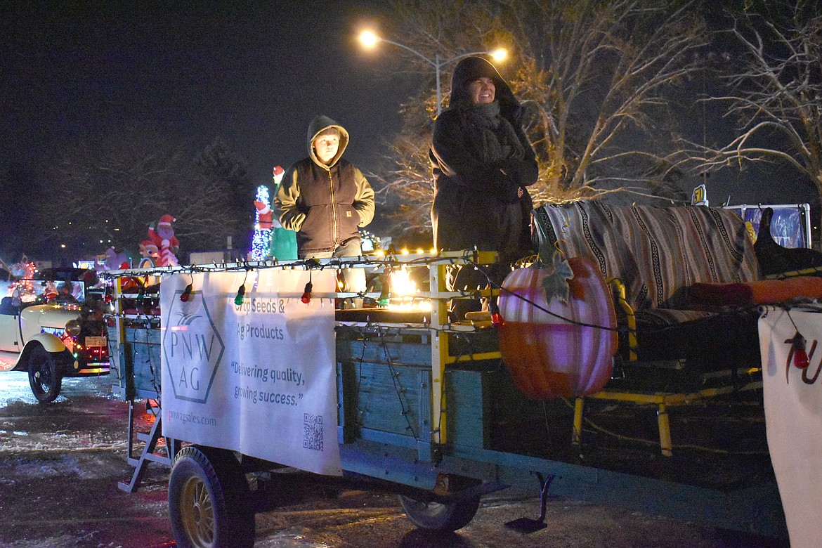 Maddie Turner, left, and her aunt  Kami Mensonides warm up on the PNW Ag and Turner Pumpkin Junction float before the Ag Parade Friday in Moses Lake.