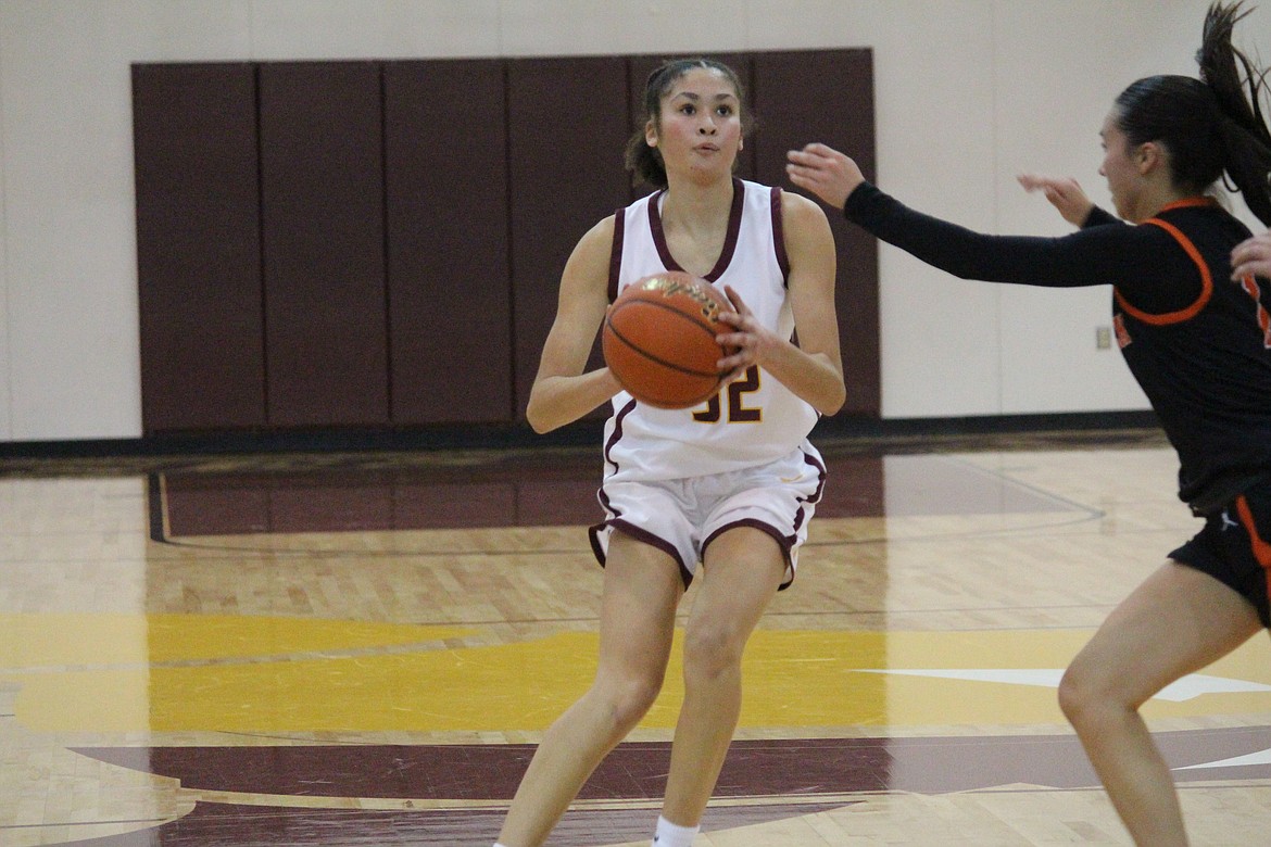 Madison Bond (32) squares up to take the shot in Moses Lake’s 55-49 loss to Kennewick.