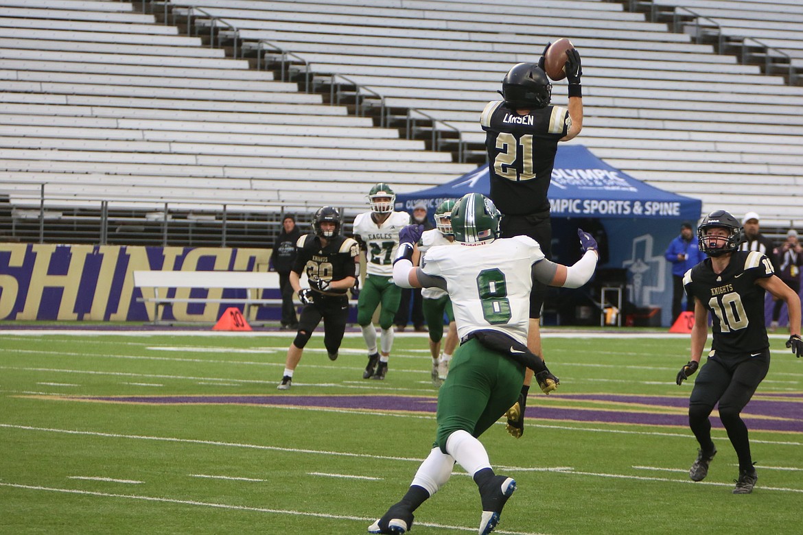 Royal junior Jackson Larsen (21) breaks up a pass on a fake punt in the second quarter.