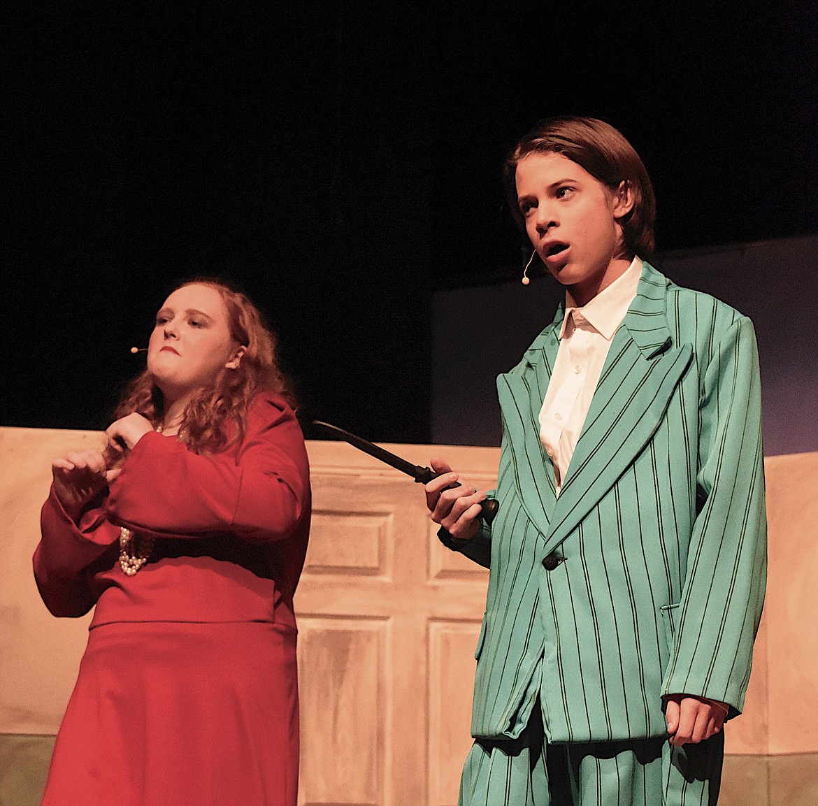 The evil orphanage director Miss Hannigan, played by Ashlin Peters, and her ne'er-do-well brother Rooster, played by Jack Huffine, plan something unsavory in the musical "Annie Jr." playing this weekend at Polson High School. (Berl Tiskus/Leader)