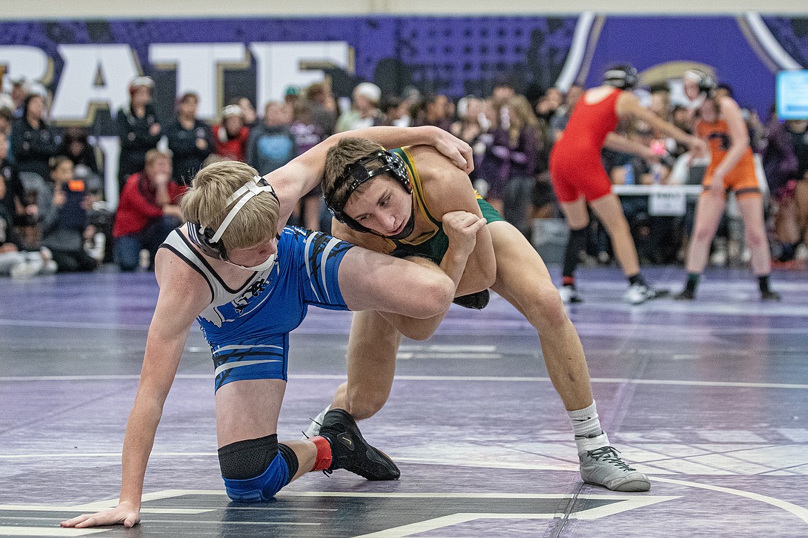 Landree Aurand gets a hold of Blue Devil Boone Venema at the Owen Invitational wrestling tournament in Polson on Friday, Dec. 1. (Avery Howe photo)