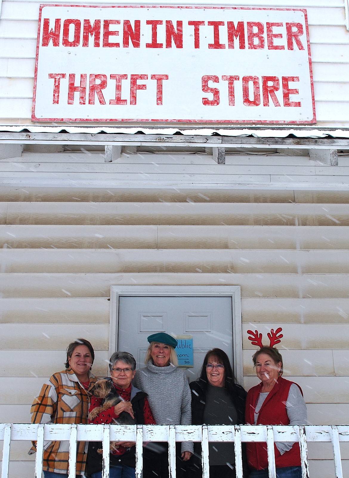 Business has never been better, and the bargains too - at the Clark Fork Women in Timber Thrift Store in Superior. On a snowy Saturday in December, the ladies volunteered to open for a special holiday shopping opportunity. (left to right) Stacy Neil, Kathy Verley with store pup Milo, Jan Allen, Kat Thompson, and Edna Peck braved the blustery weather for shoppers. (Mineral Independent/Amy Quinlivan)