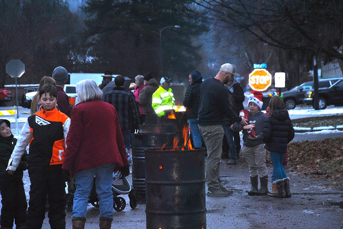 Warming barrels were provided during this year's Tree Lighting Celebration in Superior which helped take the chill off and allowed folks to mingle and drink their free hot cocoa. (Mineral Independent/Amy Quinlivan)