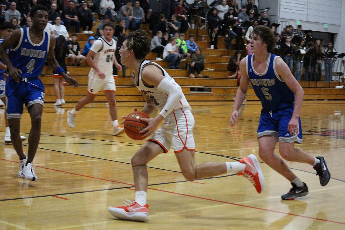 Ephrata guard Hans Roberts (12) drives the lane in the Tigers’ 56-48 loss to Pullman Saturday.