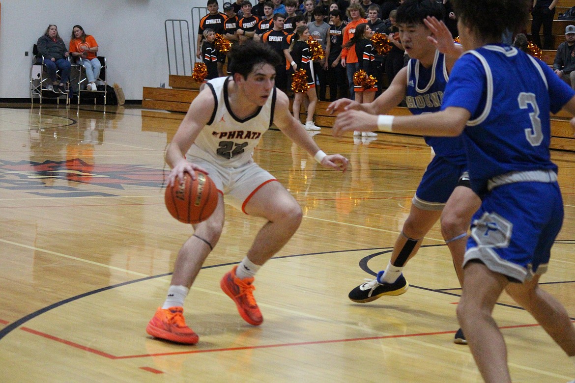 Ephrata guard Cameron Zabala (22) tests the Pullman defense in the Tigers’ 56-48 loss Saturday.