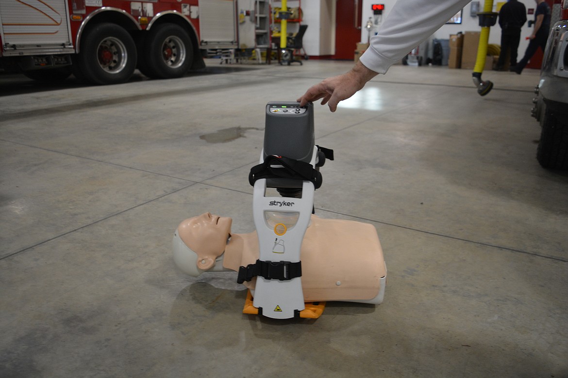 Fire Chief Scott Dietrich powers up the LUCAS automatic CPR machine at Shoshone County Fire District No. 2.