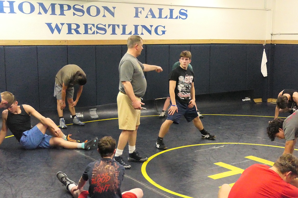 Thompson Falls head wrestling coach Mike Thilmony works with his young team during practice last week in Thompson Falls. (Chuck Bandel/VP-MI)