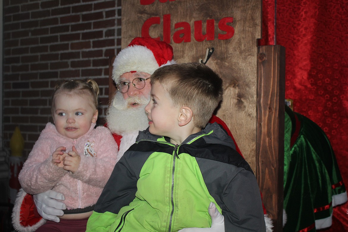 Santa Claus was very popular Saturday evening at the Christmas tree lighting in Superior. Stationed at the top of the steps going into the Mineral County Courthouse, he took requests from kids of all ages. (Monte Turner/Mineral Independent)