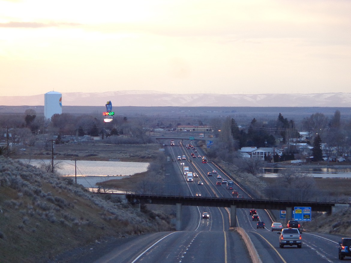 A view just before sunset of I-90 looking west from the Division Street Bridge on the very south edge of Moses Lake. I-90 is one of the state highways addressed in the Washington Department of Transportation’s draft 2024 Highway System Plan.