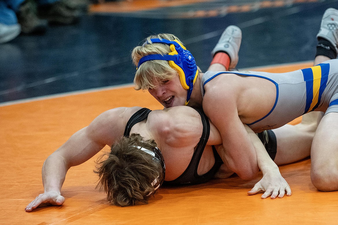 Libby wrestler Marley Erickson got the better of Florence’s Isaac Nicoson at the Owen Invitational wrestling tournament in Polson on Friday, Dec. 1. (Avery Howe/Hungry Horse News)