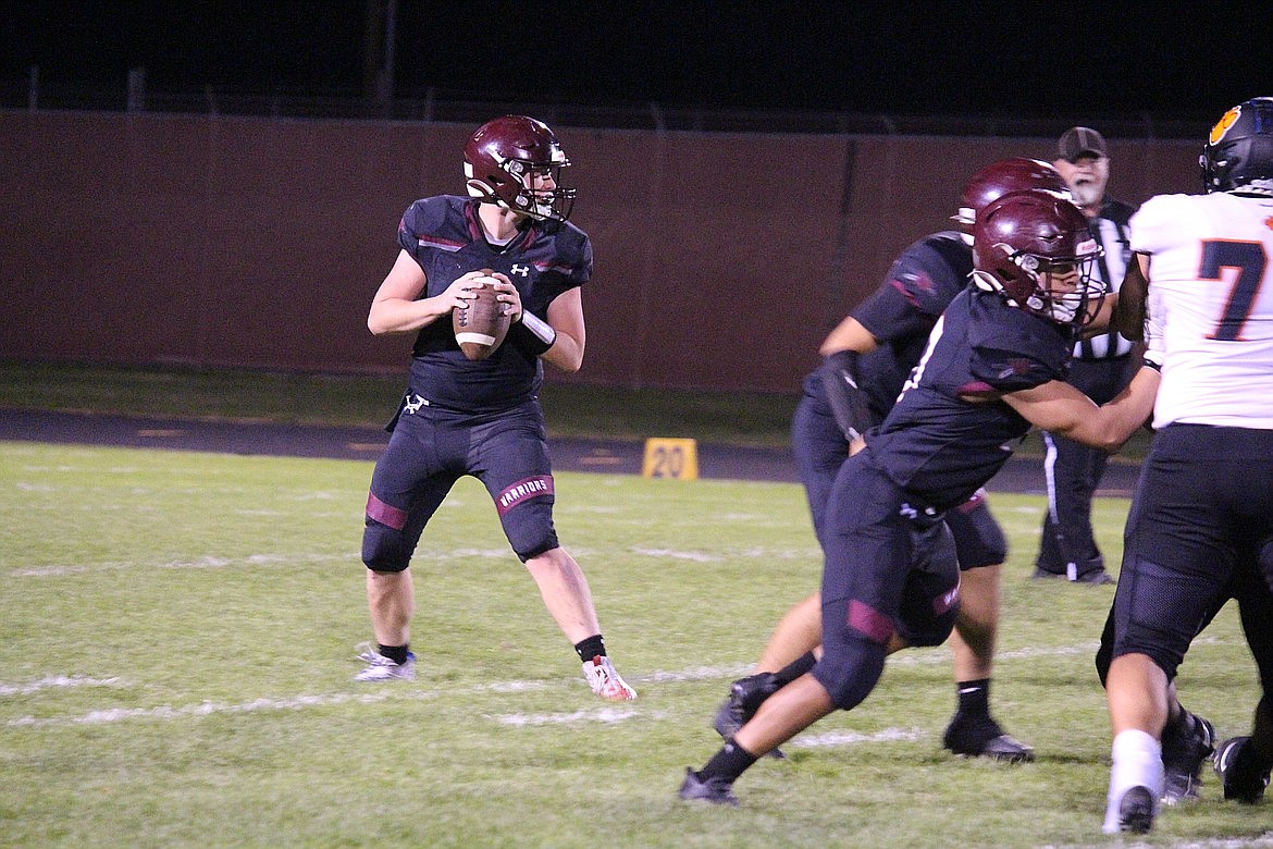 Wahluke senior Andrew Yorgesen drops back to pass during a game this fall. The Warriors ended the season with a 3-7 record.