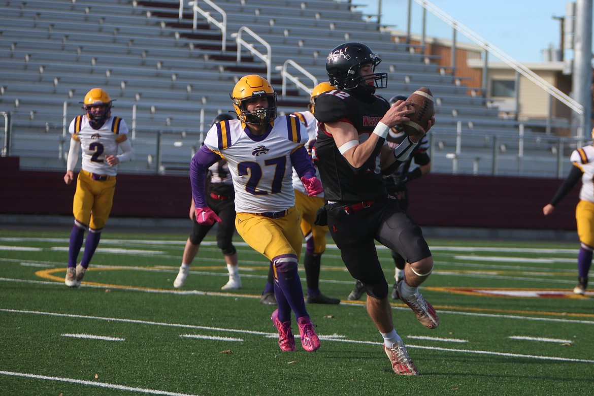 ACH freshman Max Grindy (12) catches a pass against Concrete in the opening round of the 1B State Football Playoffs. ACH finished the year 9-3, earning a No. 6 seed in the state playoffs and defeated No. 11 Concrete 42-26 before falling in the quarterfinals to No. 3 Mossyrock.