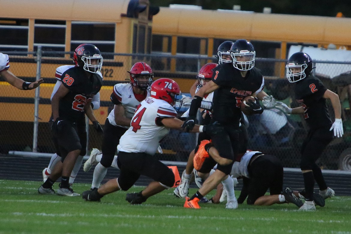 Ephrata senior Hans Roberts (1) carries the football against East Valley (Yakima). The Tigers qualified for state for the second time in as many seasons this fall, finishing the year 6-4 after a 49-0 opening-round loss to North Kitsap. Ephrata and Othello tied for the CWAC title.