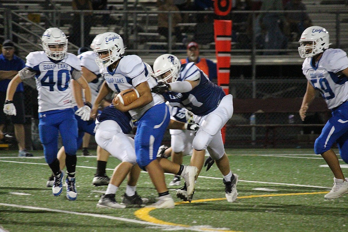 Soap Lake junior Jairo Lopez (1) carries the football against MLCA/CCS. After an 0-4 start, the Eagles rallied to finish the year with a 5-5 mark.