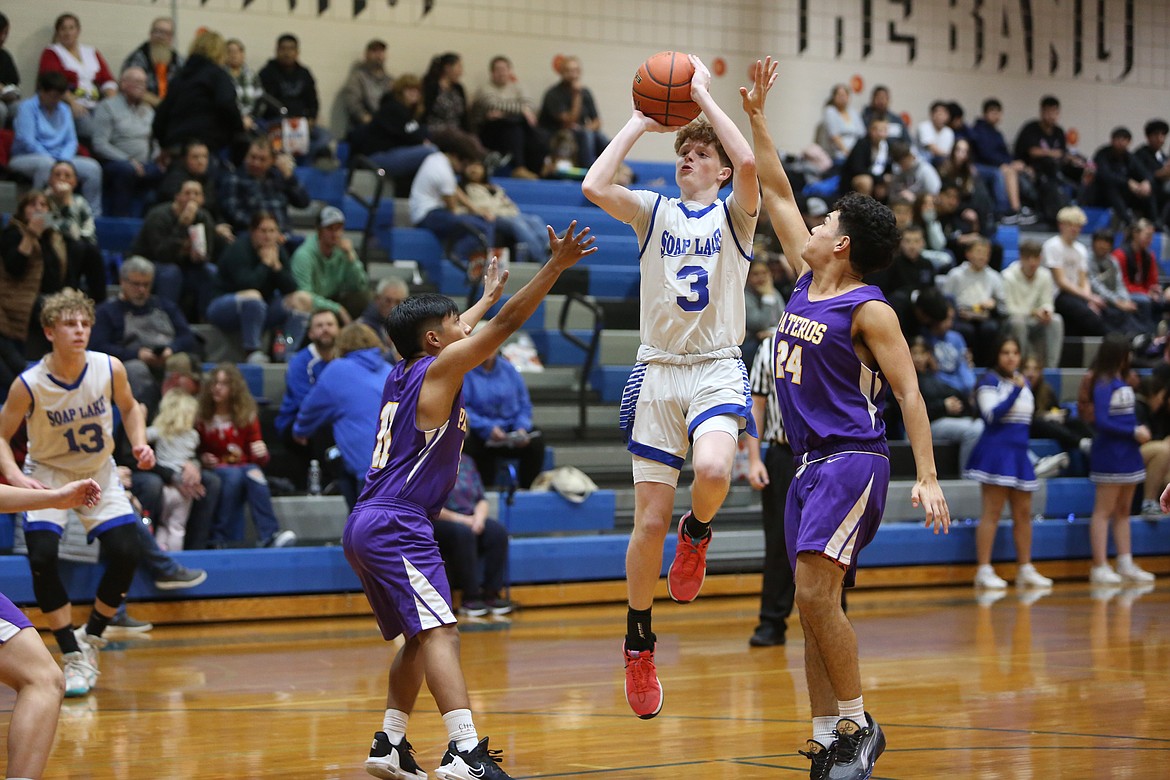 Soap Lake junior Ruvium Goloborodko (23) brings the ball up the floor in transition against Pateros on Tuesday.