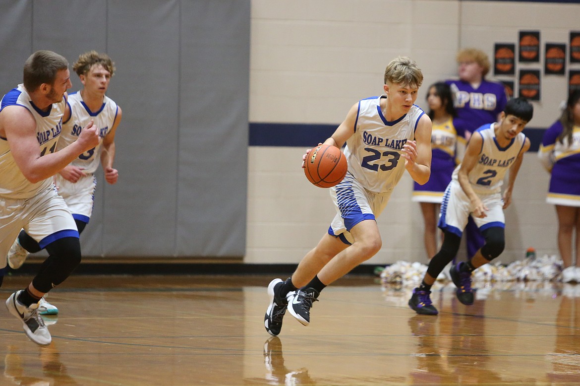 Soap Lake senior Trey Landdeck (3) attempts a jump shot in the fourth quarter against Pateros.