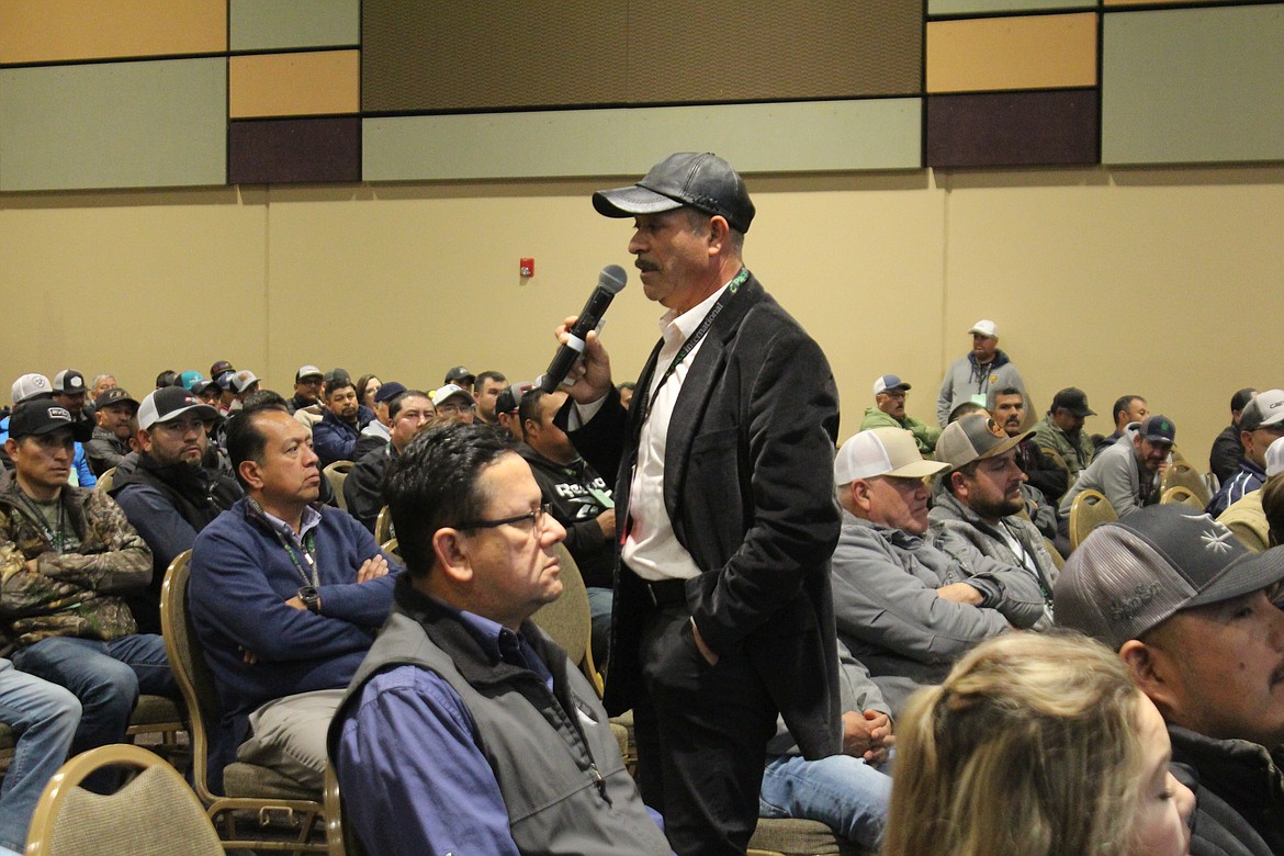 Ofelio Borges, center, gives a presentation during the Spanish-language sessions at the Washington Horticultural Association meeting Tuesday.