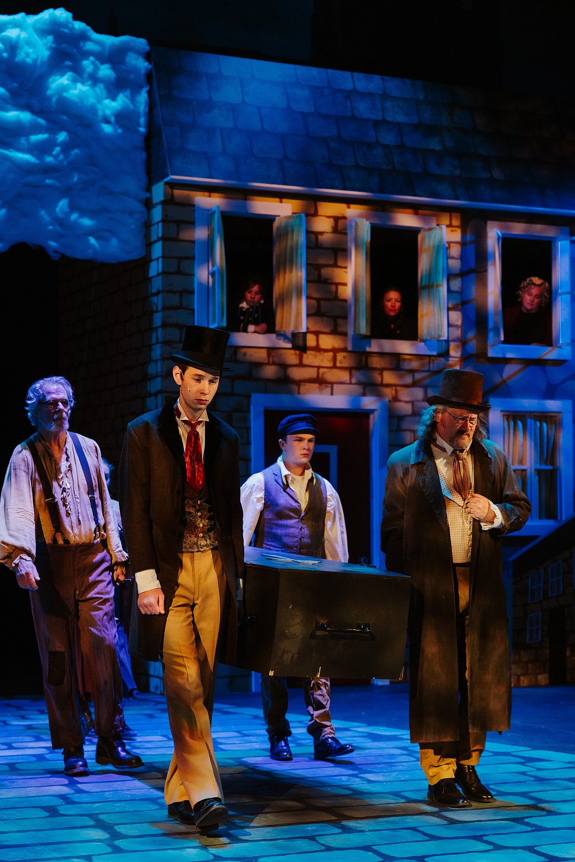 Cast members carry a casket during a dress rehearsal of Whitefish Theatre Company's 2023 production of "A Christmas Carol." (Photo courtesy of Matt Wetzler/Thewmatt Photography)