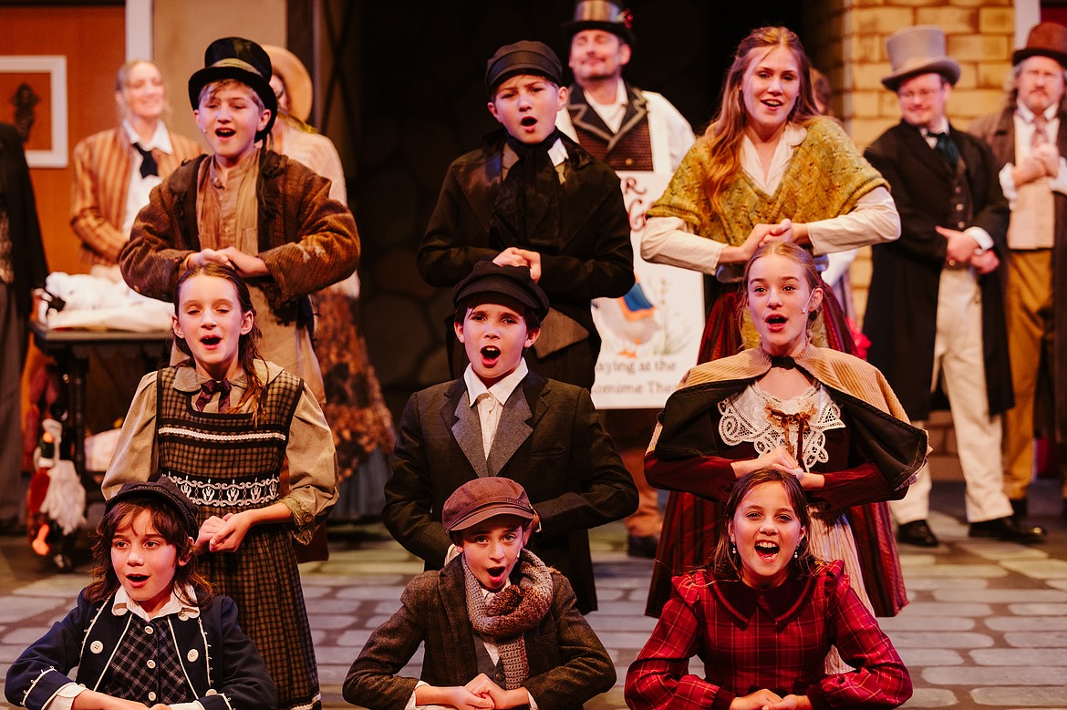 Cast members sing at the O'Shaughnessy Cultural Arts Center in Whitefish during a dress rehearsal for Whitefish Theatre Company's production of "A Christmas Carol." (Photo courtesy of Matt Wetzler/Thewmatt Photography)