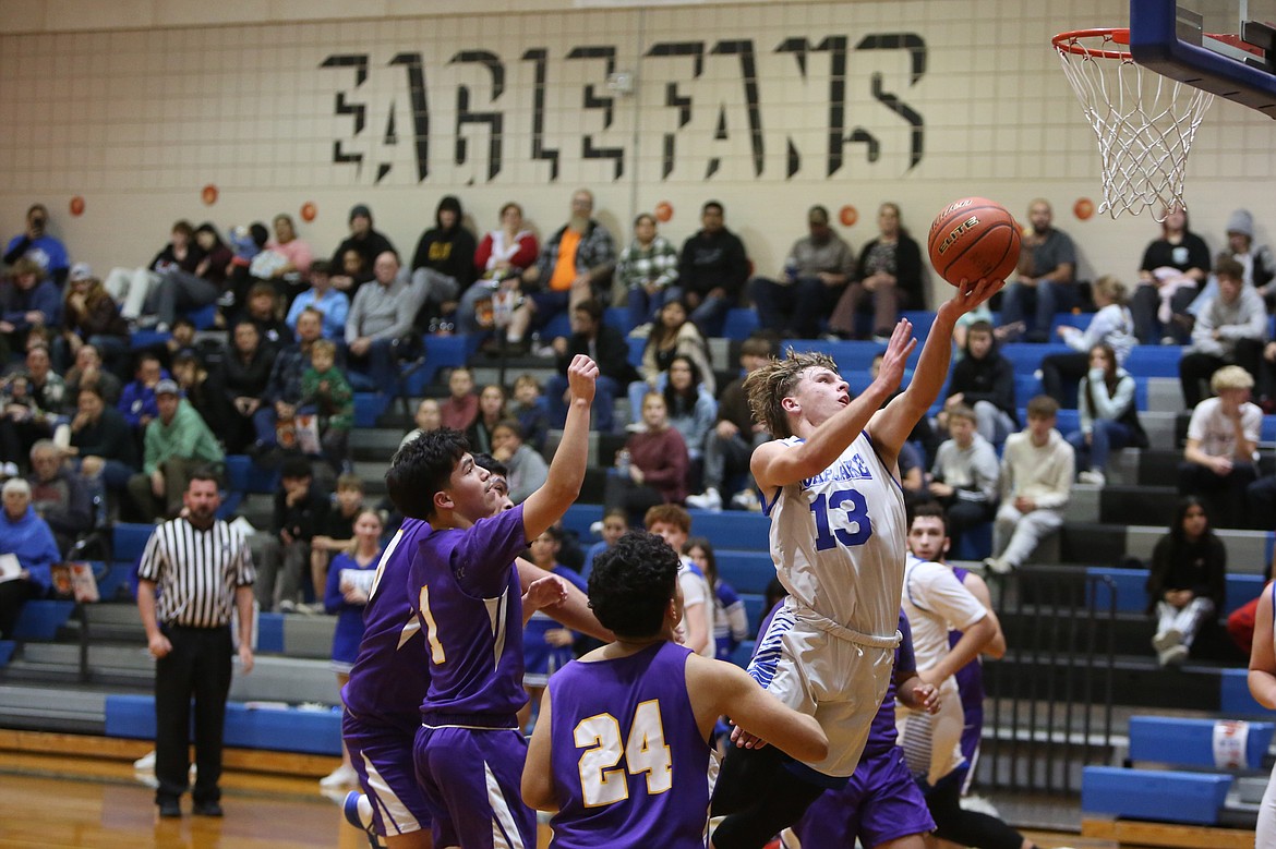 Soap Lake senior Andrey Sushik (13) drives through the Pateros defense during the Eagles’ 86-26 win on Tuesday.