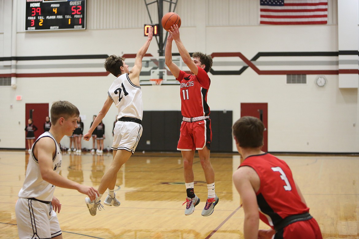 Lind-Ritzville/Sprague freshman Joey Duff (11) attempts a three-pointer against Almira/Coulee-Hartline on Saturday.