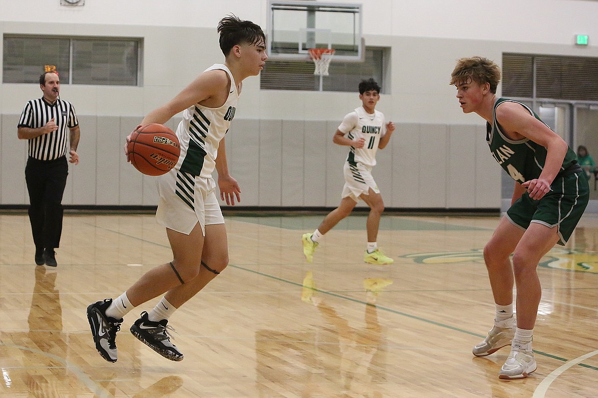 Quincy sophomore Pierce Bierlink, left, scored 20 points in Tuesday’s win over Chelan, picking up 13 rebounds and converting on four three-pointers.