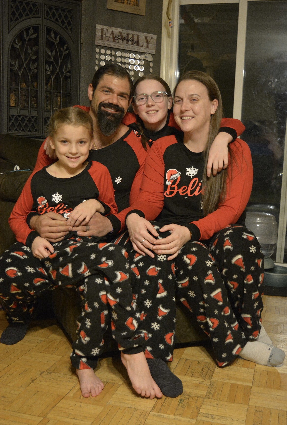 Ella Weaver and Elissa Weaver, and Tausha Winn and Matthew Hunter all wore matching pajamas to get into the Christmas spirit as they waited for a call from the North Pole on Dec. 7.