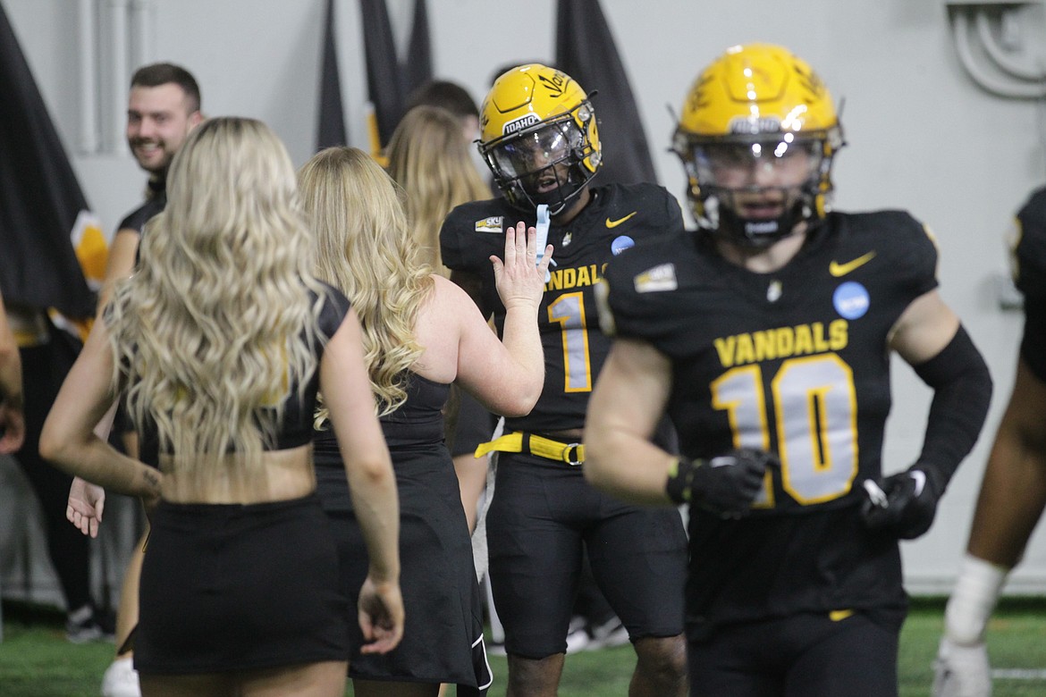 MARK NELKE/Press
Idaho's Jermaine Jackson (1) celebrates with Vandal cheerleaders after his punt return touchdown in last Saturday's win over Southern Illinois in the second round of the FCS playoffs at the Kibbie Dome in Moscow.