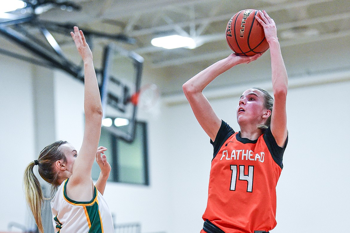 Flathead's Kennedy Moore (14) shoots in the first half against Great Falls CMR at Gene Boyle Gym on Saturday, Dec. 9. (Casey Kreider/Daily Inter Lake)