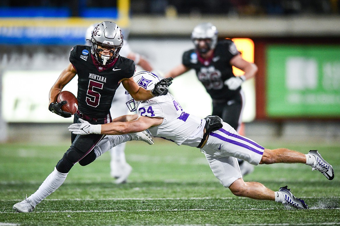 Grizzlies wide receiver Junior Bergen (5) picks up yardage on a 9-yard reception in the first quarter of an FCS Playoff game against Furman at Washington-Grizzly Stadium on Friday, Dec. 8. (Casey Kreider/Daily Inter Lake)