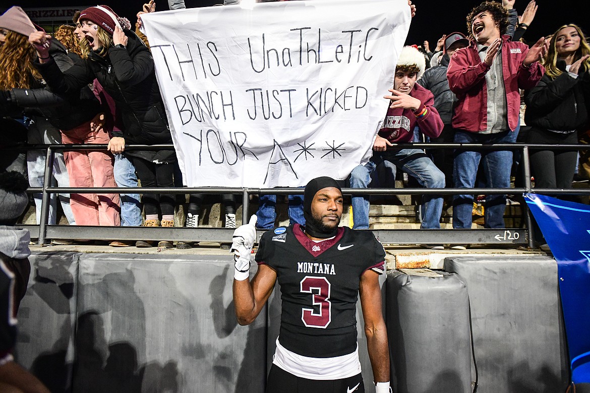 Grizzlies safety TraJon Cotton (3) points to a sign in the stands after a 35-28 overtime win over Furman in an FCS Playoff game against Furman at Washington-Grizzly Stadium on Friday, Dec. 8. (Casey Kreider/Daily Inter Lake)