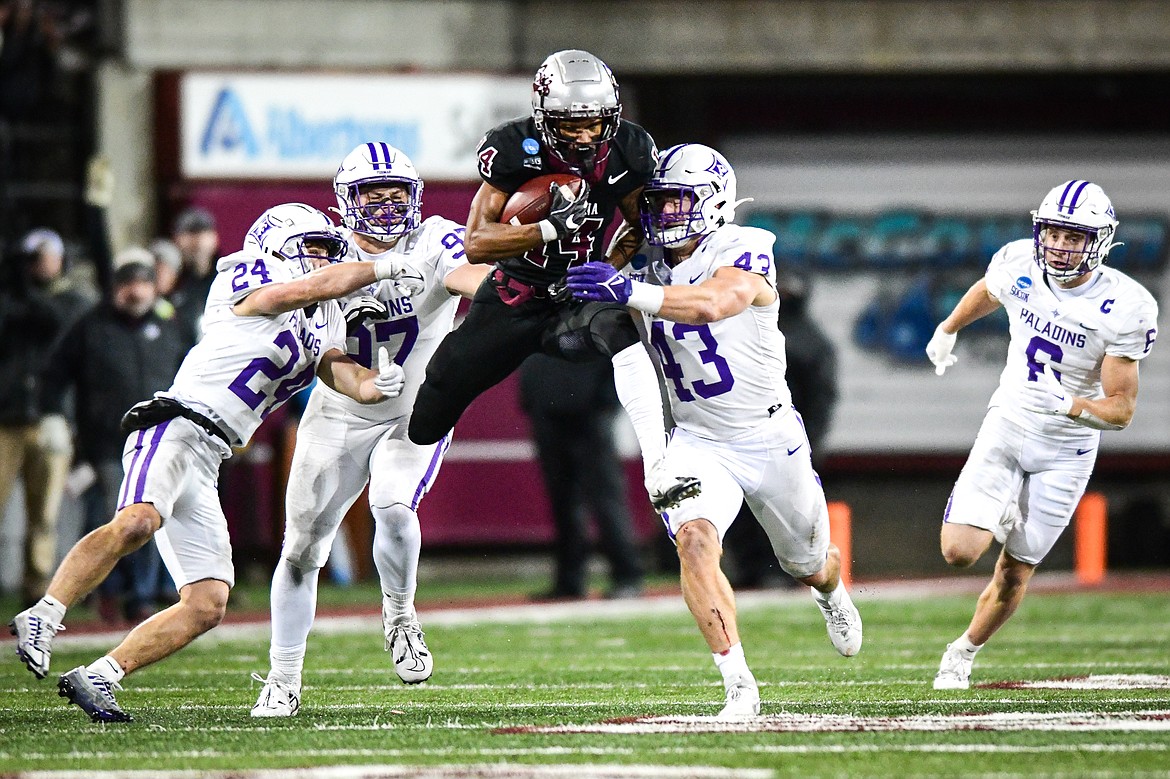 Grizzlies wide receiver Aaron Fontes (14) is brought down on a 12-yard reception in the third quarter of an FCS Playoff game against Furman at Washington-Grizzly Stadium on Friday, Dec. 8. (Casey Kreider/Daily Inter Lake)