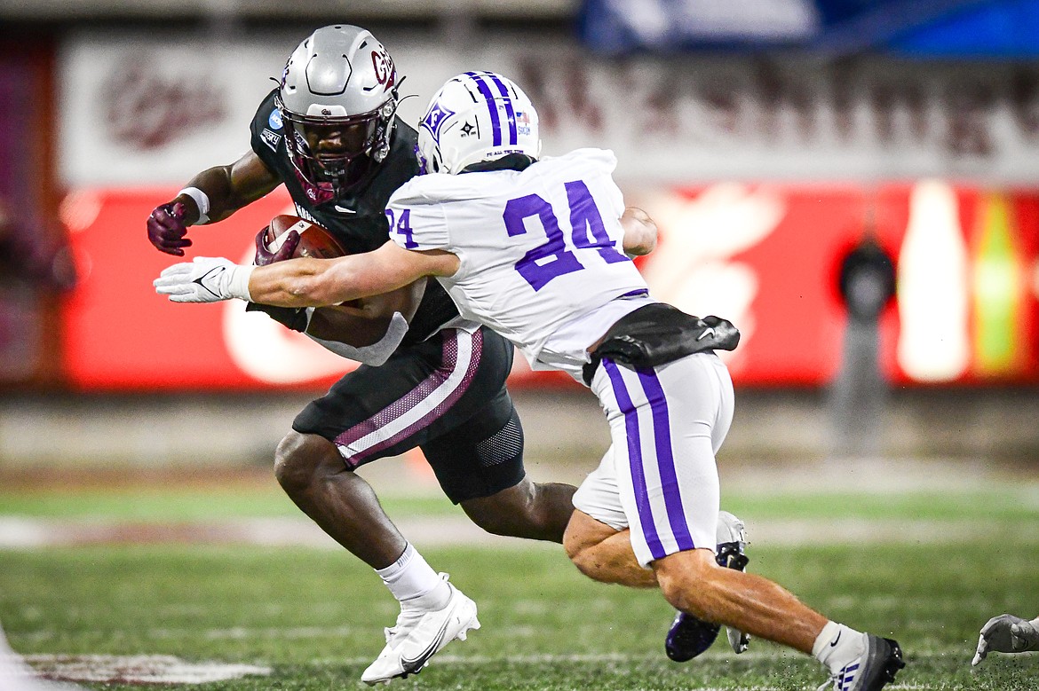 Grizzlies running back Eli Gillman (10) looks for running room after a reception in the first quarter of an FCS Playoff game against Furman at Washington-Grizzly Stadium on Friday, Dec. 8. (Casey Kreider/Daily Inter Lake)