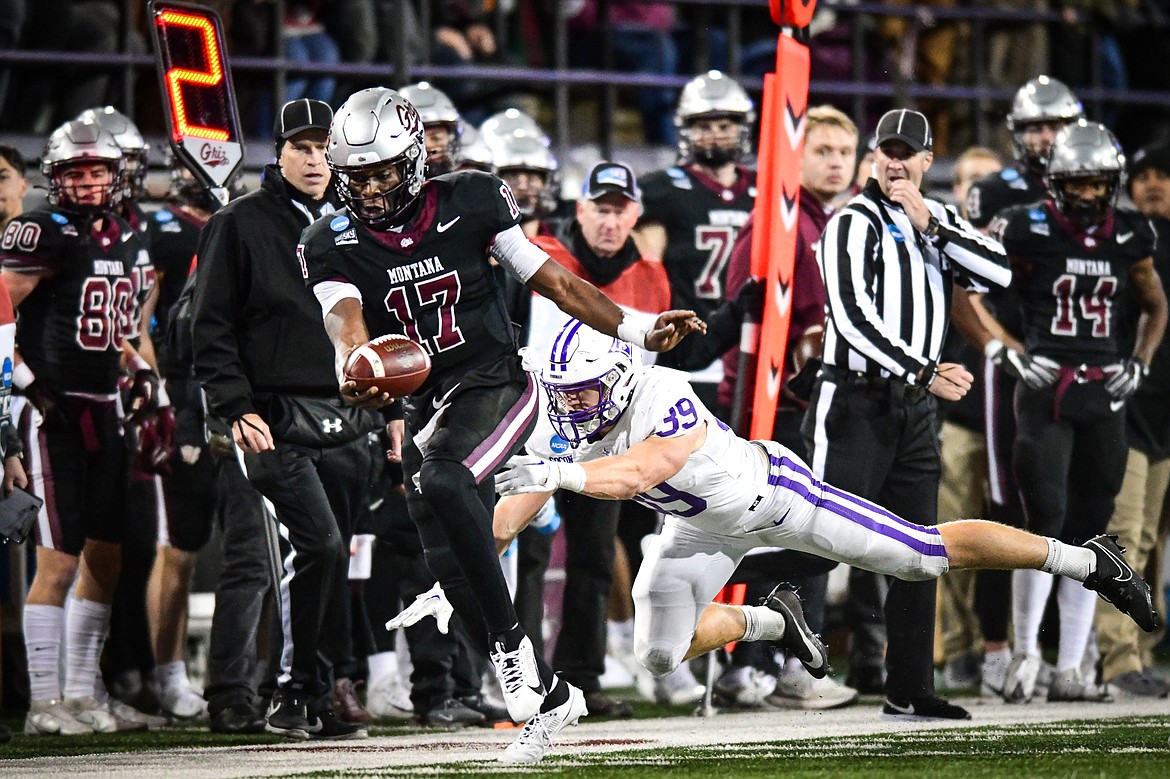 Grizzlies quarterback Clifton McDowell (17) reaches for a first down on a run in the third quarter of an FCS Playoff game against Furman at Washington-Grizzly Stadium on Friday, Dec. 8. (Casey Kreider/Daily Inter Lake)