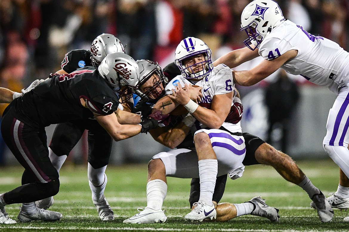 Grizzlies defenders stop a run by Furman quarterback Tyler Huff (6) in the third quarter of an FCS Playoff game against Furman at Washington-Grizzly Stadium on Friday, Dec. 8. (Casey Kreider/Daily Inter Lake)