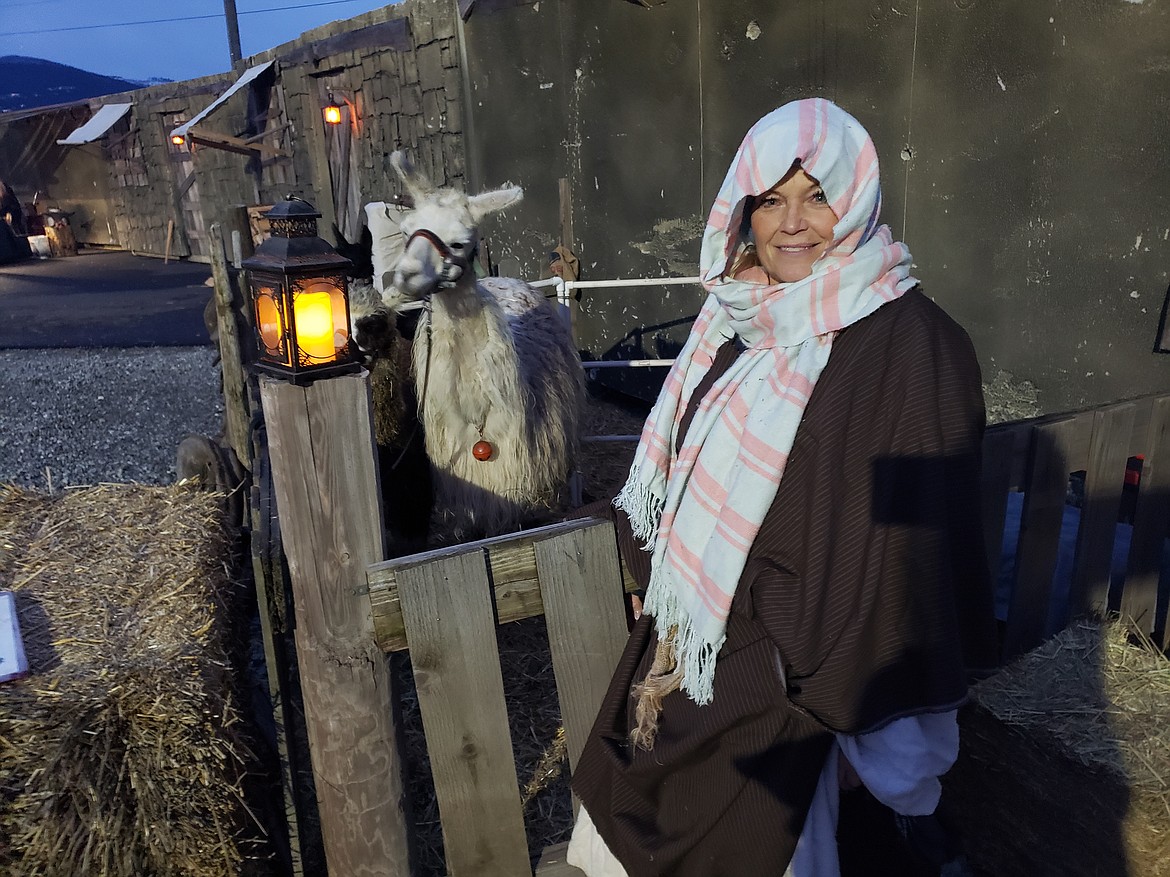 2nd Chance Ranch owner Joy Chance and her llama, Hermione, participate in a Nativity reenactment at Stateline Speedway on Saturday. Chance also brought several sheep, which were led by a shepherd during the enactment.