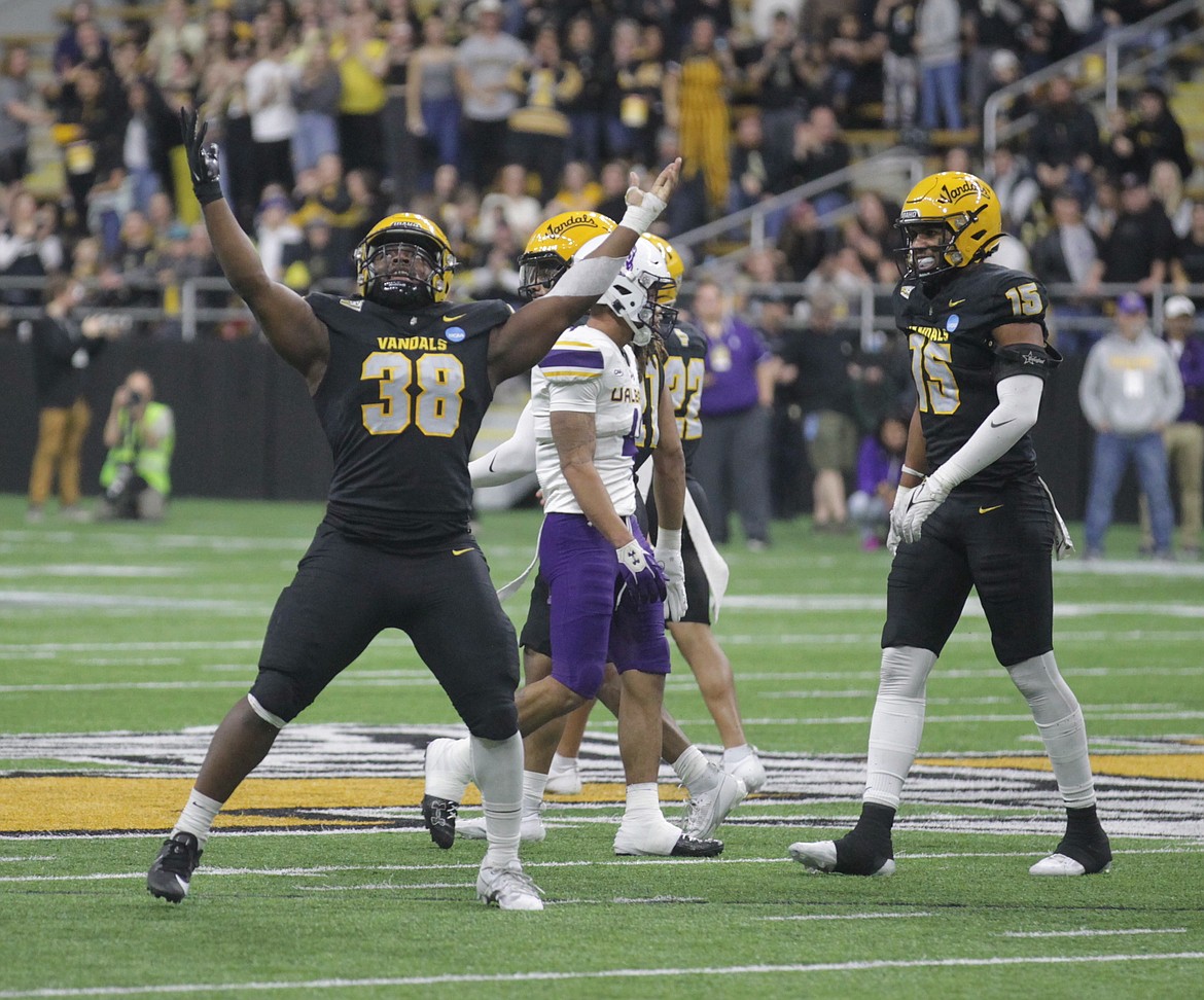 MARK NELKE/Press
Tylen Coleman (38) of Idaho celebrates a sack of UAlbany quarterback Reese Poffenbarger in the second quarter of an FCS semifinal game Saturday night at the Kibbie Dome in Moscow.