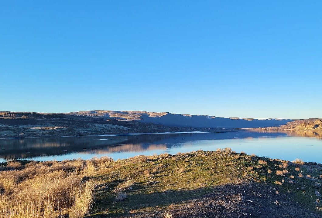 Sun shines over Soap Lake and the cliffs north of the lake Friday afternoon. While last week saw bits of sun, the upcoming week is looking a bit on the dreary side from time to time.