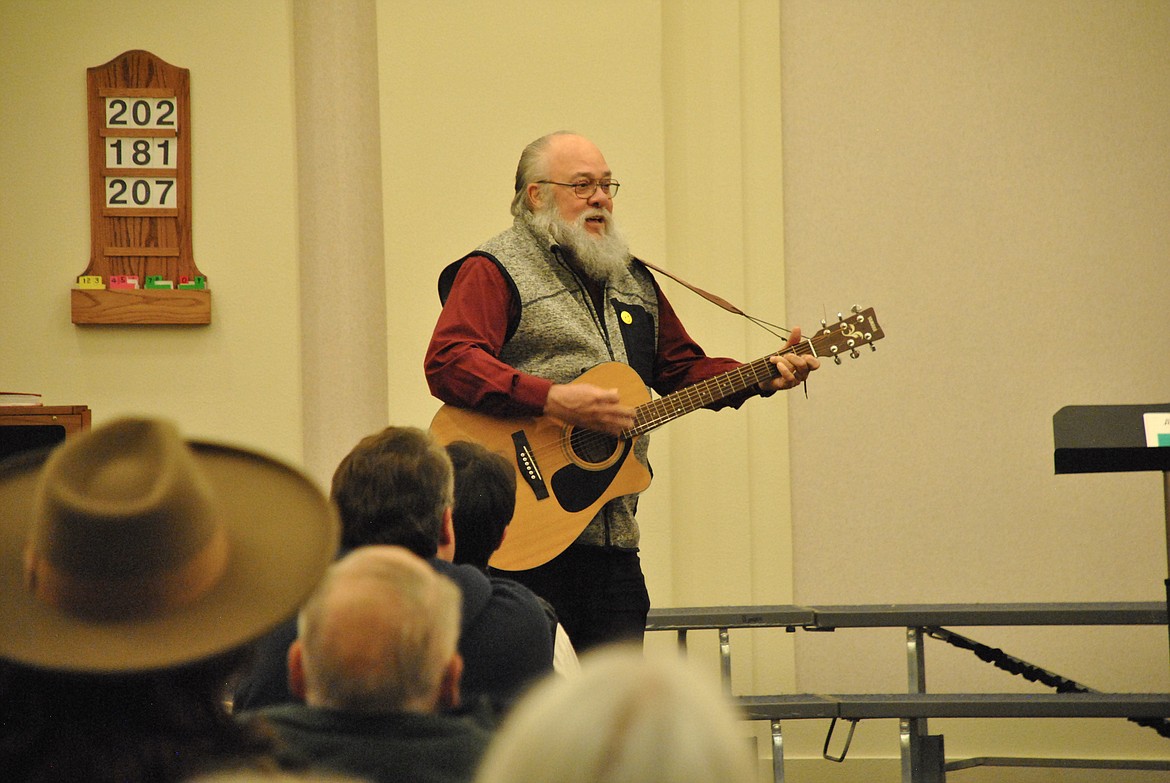 Ron Anderson reprised his special role of playing Feliz Navidad on his guitar, the audience clapped along joyfully. (Mineral Independent/Amy Quinlivan)