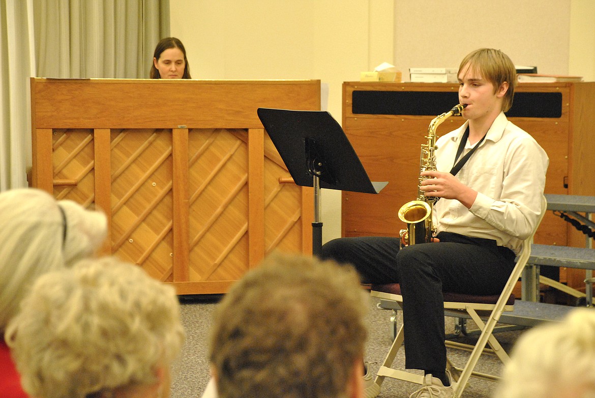 Jason Merrill performed Silent Night on his Saxophone while his mother Debbie Merrill accompanied him on Piano. (Mineral Independent/Amy Quinlivan)