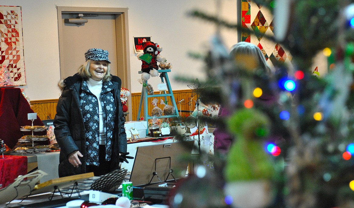 Susan Charles caught up with Janet Hughes during the annual St. Regis Christmas Bazaar at the Community Center took place on Saturday December 8. The center was packed full of an assortment of vendors selling all kinds of Christmas gifts from wooden bowls, handmade agate jewelry, homemade soaps and lotion bars, and tasty holiday treats. Some sellers noted that it was a slow start to the day, but after lunch crowds picked up and business did too . (Mineral Independent/Amy Quinlivan)