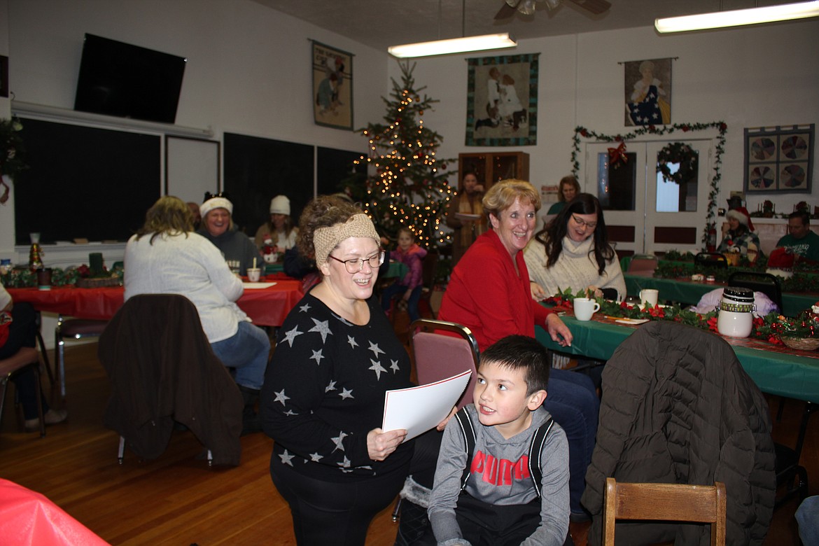 After marshmallow roasting outside, inside the Old DeBorgia School, caroling,  cookies, candies and camaraderie took place.