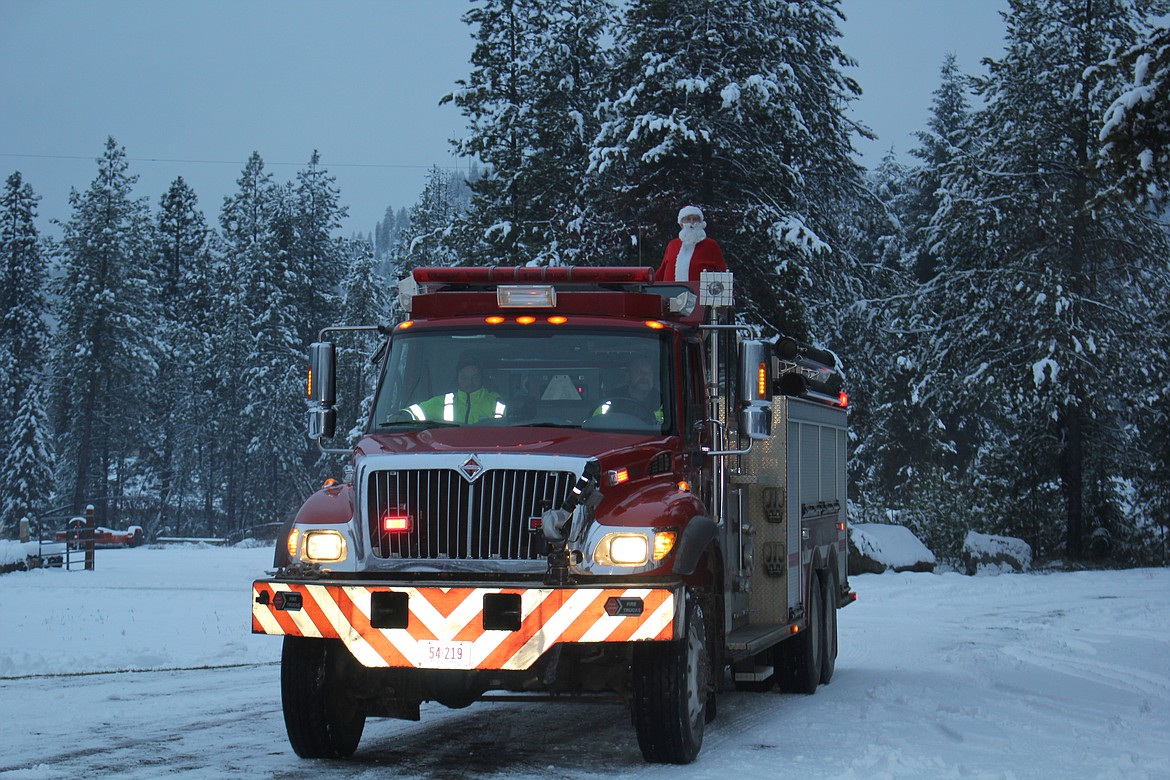 Santa arrived on a West End Volunteer Fire Truck with lights flashing and sires screaming.