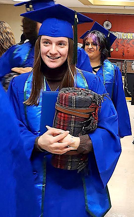 HSE graduate Kenslie Fisher has a smile on her face after receiving her HSE diploma. (Berl Tiskus/Leader)