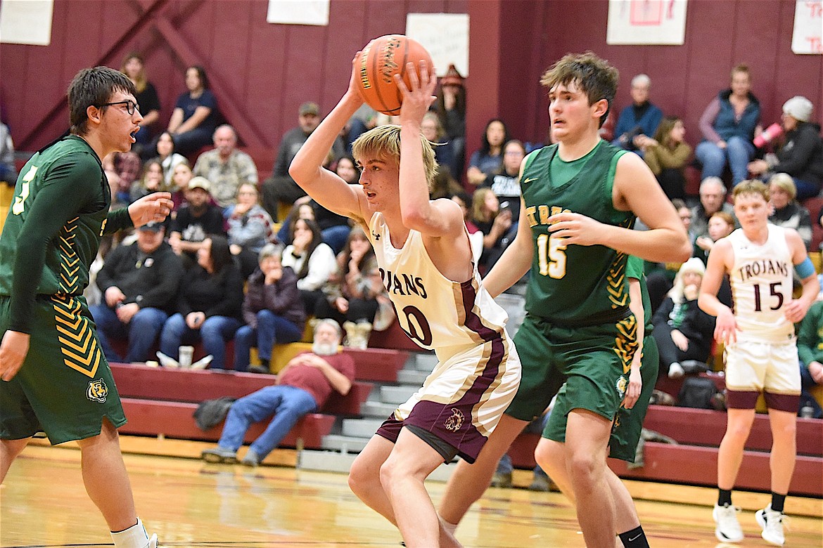 Troy's Kempton Sloan grabs a rebound on Saturday, Dec. 9, against St. Regis. (Scott Shindledecker/The Western News)